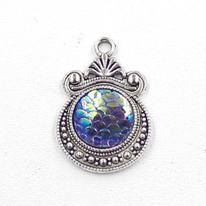 Detailed view of 12mm silver scale pendant charm with iridescent rainbow texture inlay
