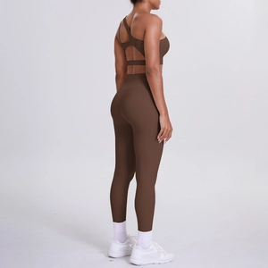 Detail view of deep brown high-waist yoga leggings and cross-back sports bra set