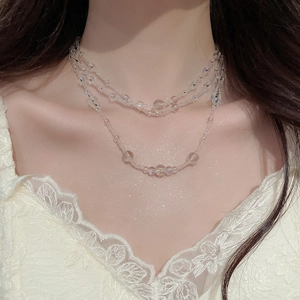 Detail shot of multi-layer aurora glass bead necklace with shimmering translucent finish
