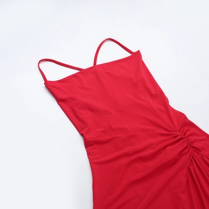 Detailed flat lay of red cowl neck dress showing thin straps and side ruched textures