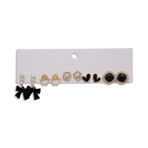 Ten-piece set of elegant bow, pearl and heart earrings in gold and black on display card