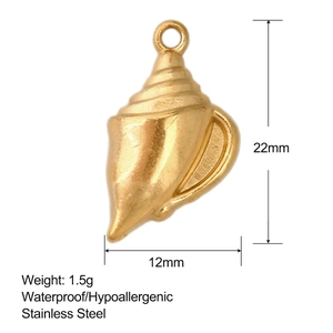 Macro view of gold conch shell charm with size dimensions and waterproof label