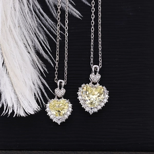 Macro detail of Heart of the Ocean S925 silver necklace with yellow heart-shaped gemstone