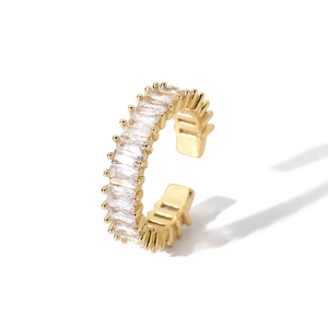 Detail of 18k gold plated C-shaped ring featuring square cubic zirconia stones