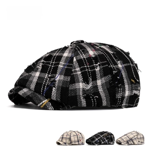Vintage distressed plaid newsboy cap with colorful paint splatters and ripped details