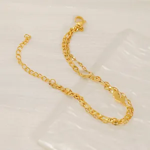 Gold double-layered stainless steel chain bracelet with small heart charm and lobster clasp