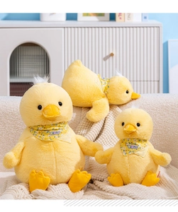 Close-up of three plush yellow ducks in various sizes with Summer print scarves