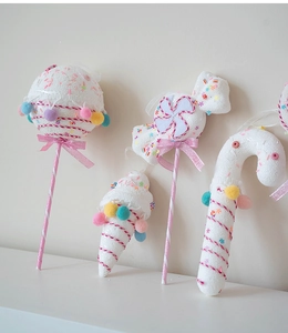Set of four pastel foam candy ornaments including lollipop and ice cream for Xmas