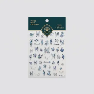 Holographic butterfly nail art stickers with iridescent blue-green laser effects