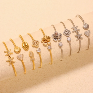 Minimalist stainless steel open bangle with starfish shell motifs and sparkling zircon