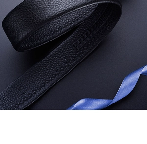 Close-up of black leather belt with lychee texture and inner teeth for automatic buckle