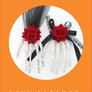 Detail of Halloween skeleton hand hair clips with red roses and black lace mesh