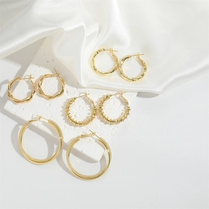 Set of four French vintage gold hoop earrings with twisted and textured designs