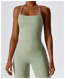 Front view of sage green yoga set with thin strap vest and high-waist sports leggings