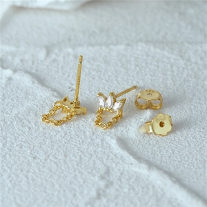 Detailed macro view of S925 sterling silver gold crown stud with marquise zircon and chain
