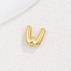 Detailed view of glossy 18K gold plated puffy letter W charm for DIY jewelry