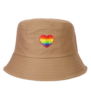 Close-up of rainbow heart embroidery on khaki cotton bucket hat with neat stitching