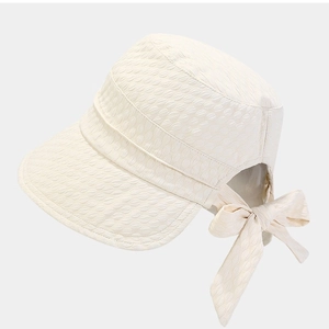 Off-white foldable sun bucket hat with bow detail and ponytail hole for women