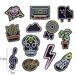 Neon glow style embroidery patches set featuring cassette and skull motifs for DIY decor