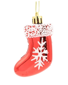 Detail of red Christmas stocking ornament with white snowflakes and golden hanging loop