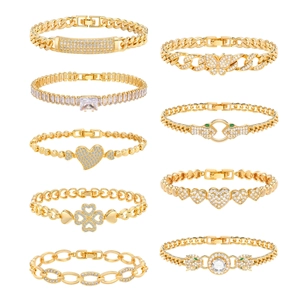 Set of 10 gold plated hip hop bracelets with clear zircon inlays on white background