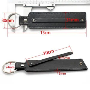 Black faux leather 8mm keychain strap with silver metal ring and rivet details