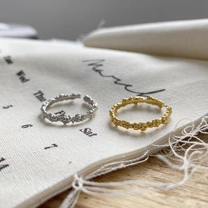 Detailed view of gold and silver irregular bubble textured S925 adjustable rings