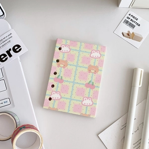 Close-up of pink and yellow plaid M5 binder cover with cute bear and rabbit illustrations