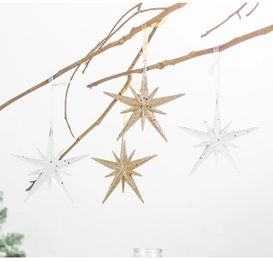 Champagne gold and silver glitter star ornaments hanging on branches for Christmas tree