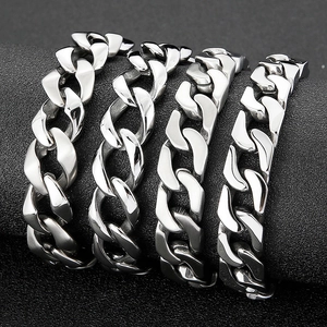 Polished stainless steel Cuban link chains in four widths on a sleek display
