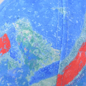 Detail of colorful geometric gradient twill fabric with sturdy double-stitch sewing