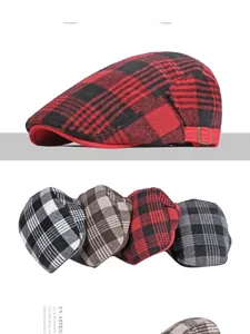 Detail of checkered newsboy cap showing adjustable metal side buckle and thick wool texture