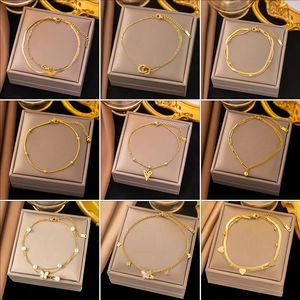 Nine various styles of elegant gold layered anklets with heart and butterfly charms