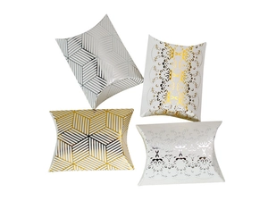 Detail of four pillow gift boxes featuring gold and silver hot stamping patterns