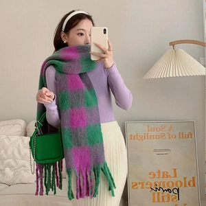 Detailed view of tie-dye plaid cotton scarf featuring handmade long knotted tassels