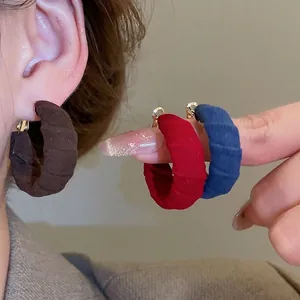 Minimalist fabric wrapped C-shaped gold hoop earrings in assorted vintage colors