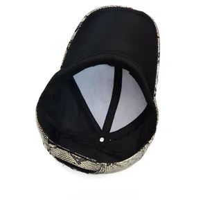 Detailed view of snake skin pattern baseball cap internal structure with black lining