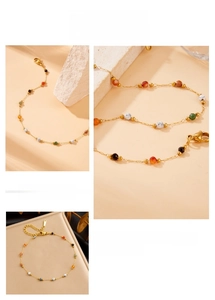 Detail of bohemian gold chain anklet featuring multicolor beads and lobster clasp