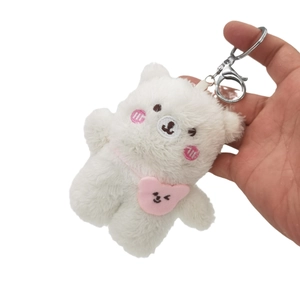 Cute white plush bear keychain with pink heart decoration and silver metal hook for bags