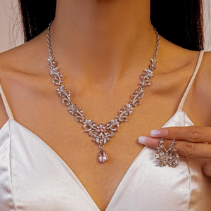 Elegant silver V-shaped leaf necklace set with pink crystal teardrops for women