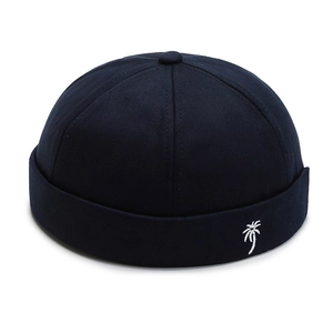 Navy blue docker hat with white coconut tree embroidery, minimalist retro brimless cap style
