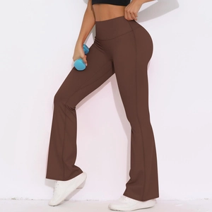 Detail view of high-waist yoga flared pants in dark coffee brown with dumbbell prop