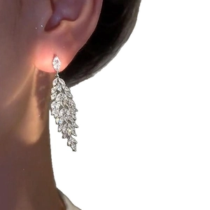 Silver leaf tassel earrings with zircon stones, elegant feather design for women
