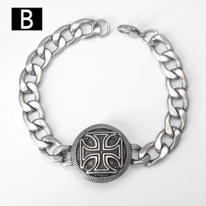 Detail of a men's stainless steel Cuban chain bracelet with a vintage cross medallion