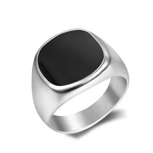 Macro detail of men's vintage titanium steel ring featuring a square black stone inlay