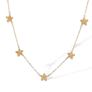 Detailed view of the gold necklace featuring five delicate flower pendants on a white background