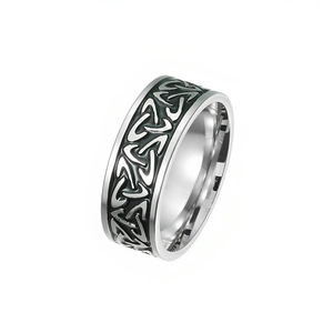 Detailed view of vintage titanium steel ring with intricate Celtic knot patterns.