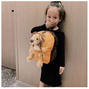 Close-up of cute cartoon lion plush backpack with a detachable doll for kids
