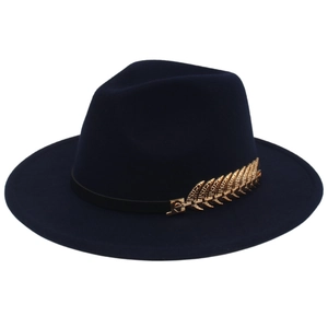Detailed view of dark blue wool fedora featuring a decorative golden wheat leaf pin