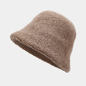 Detailed macro view of the brown wool blend knit texture on this warm winter bucket hat